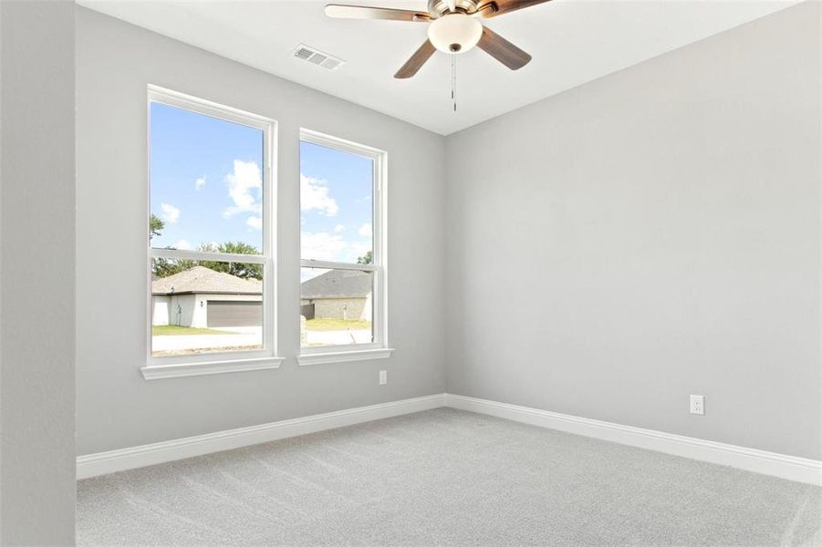 Unfurnished room with carpet flooring and ceiling fan