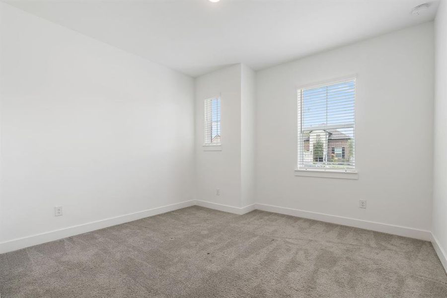 Another secondary bedroom with lots of natural light.