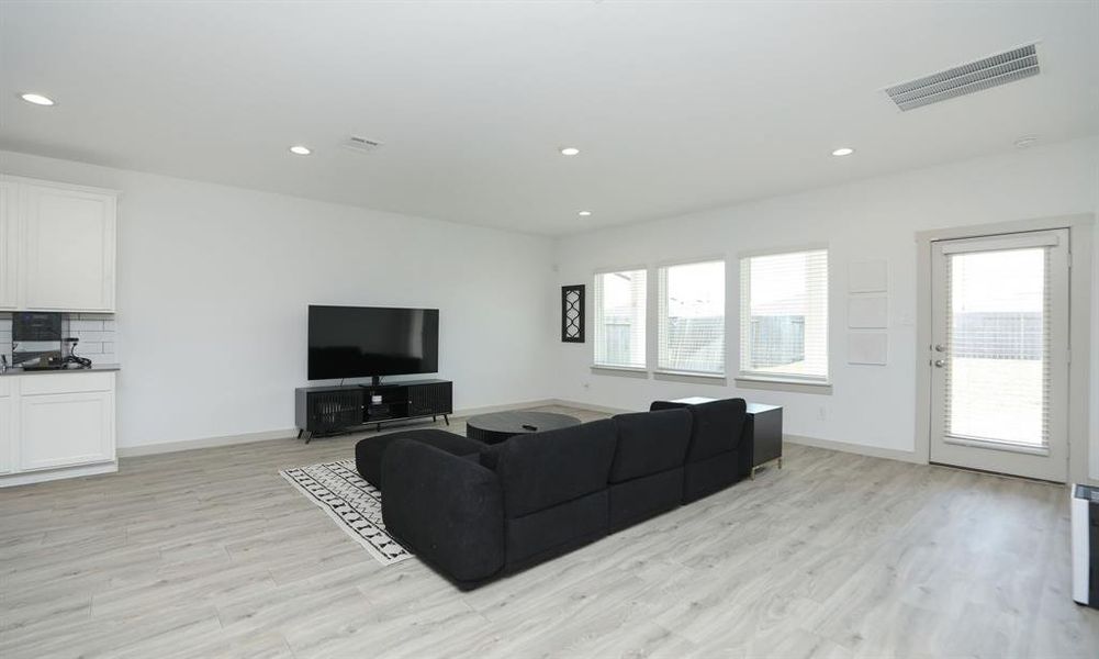 Open family room that overlooks the back yard with plenty of natural light.