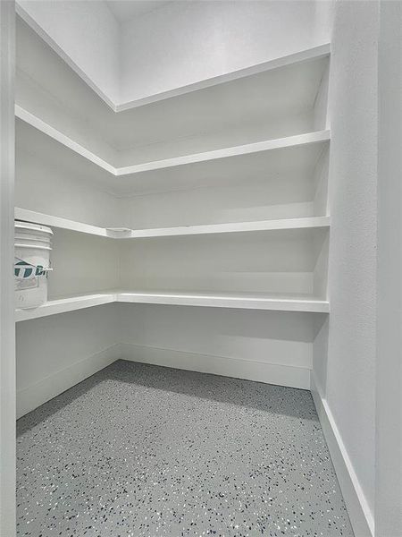 GARAGE WALK-IN STORAGE CLOSET.