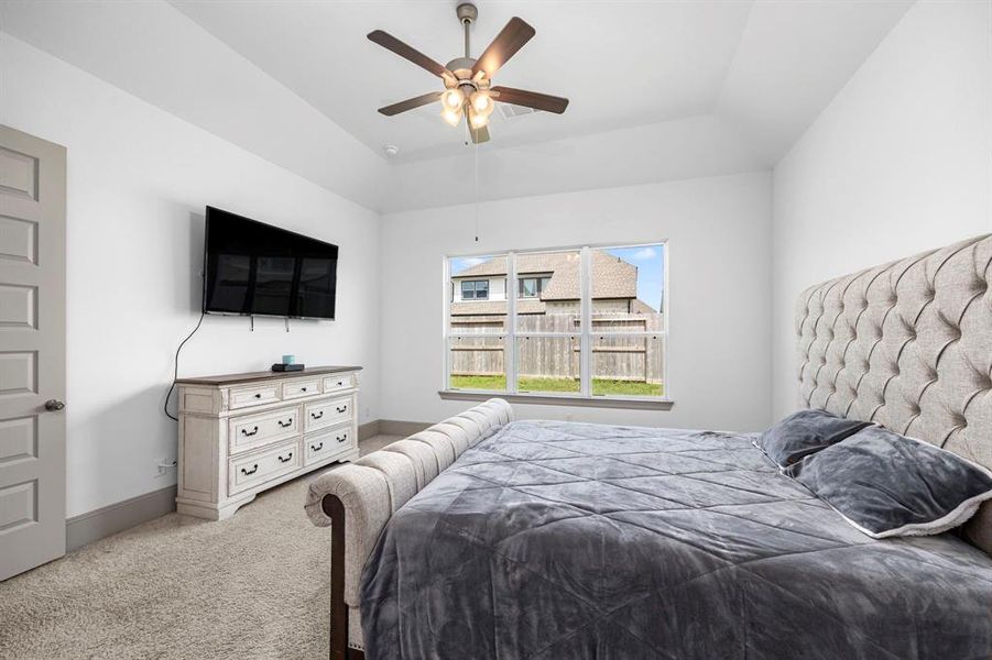 Large primary bedroom has plenty of space and natural light.