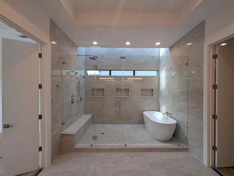 Wet room with windows and skylights serves as a luxurious and relaxing way to unwind in the evening or to prepare for a new day.