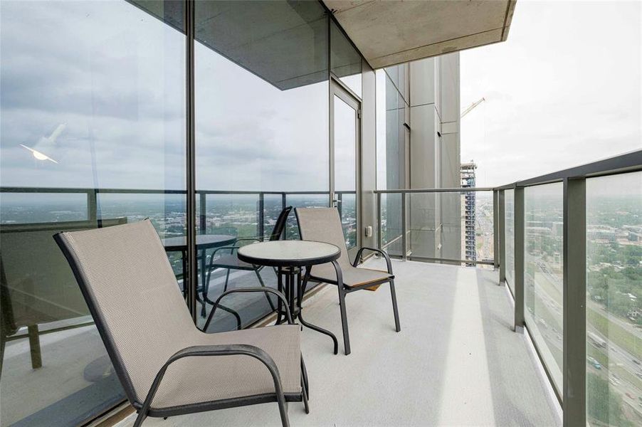 Glass deck on 38th floor overlooking Lady Bird Lake and downtown Austin