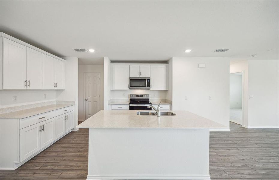 Oversized island in kitchen *real home pictured