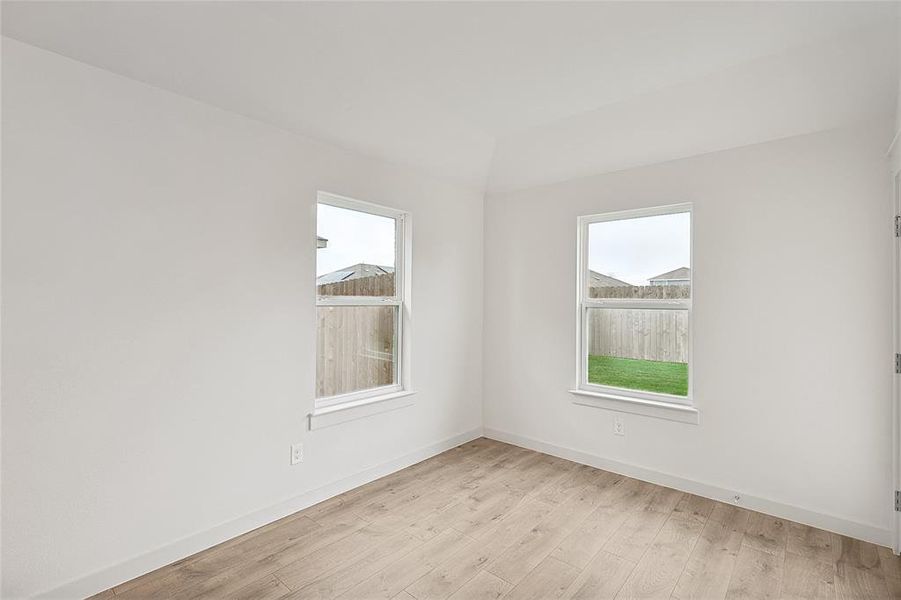 Empty room with light wood-type flooring