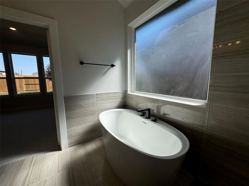 You'll want to escape and relax in your standalone soaker bathtub.