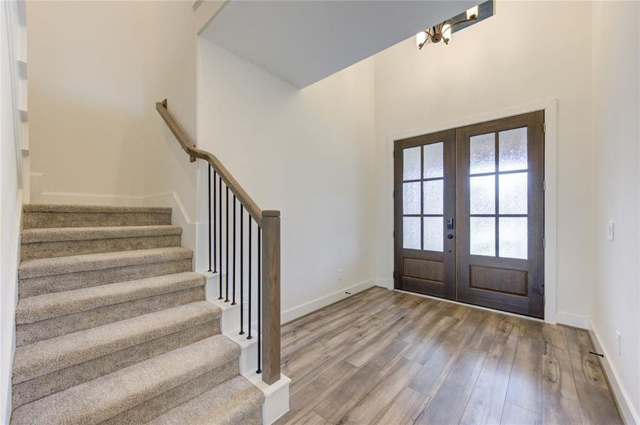 Spacious entryway and stairwell which leads to the second level.