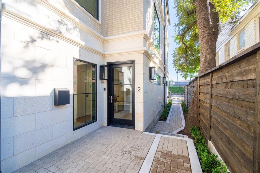 Doorway to property featuring a patio