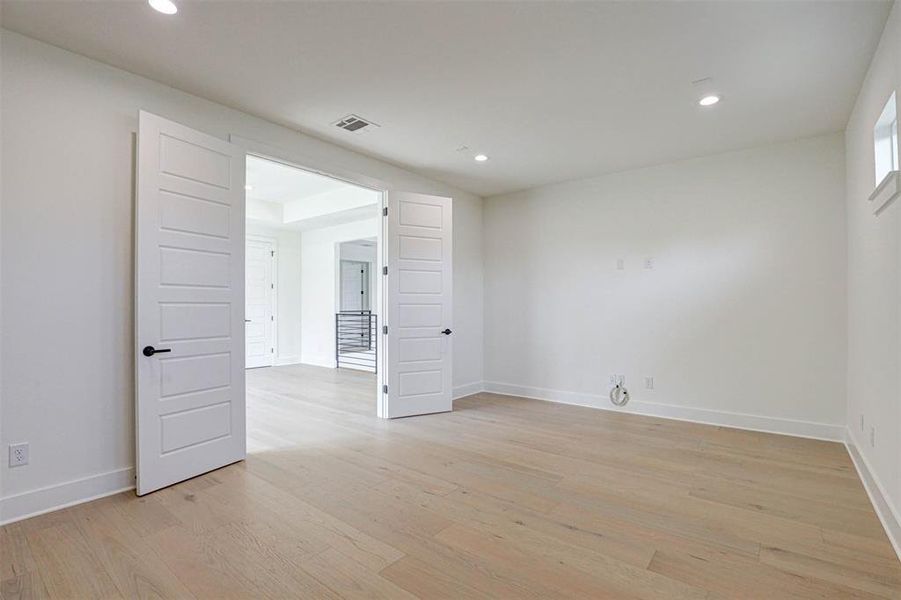 Spare room with light hardwood / wood-style flooring