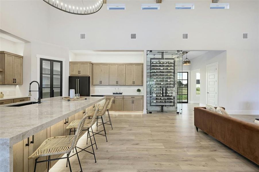 Beautiful custom cabinetry with extra storage under the large kitchen island.