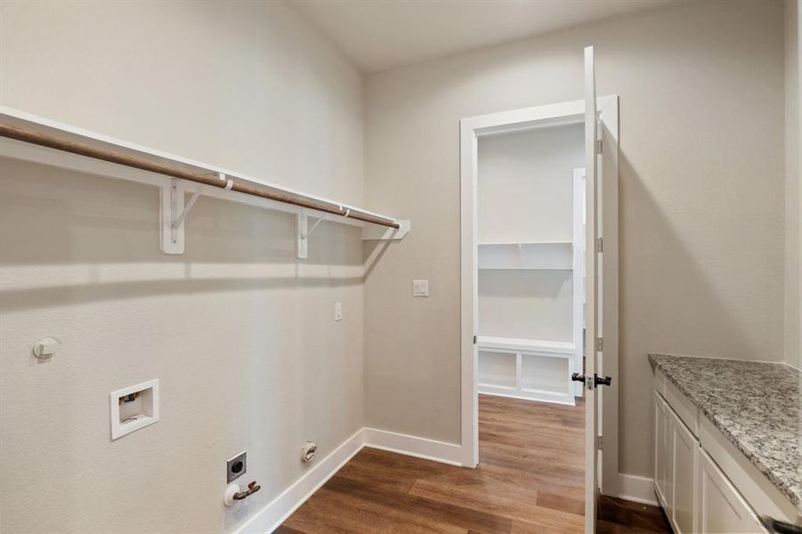 Laundry room accessible from the mud room AND the primary closet!!
