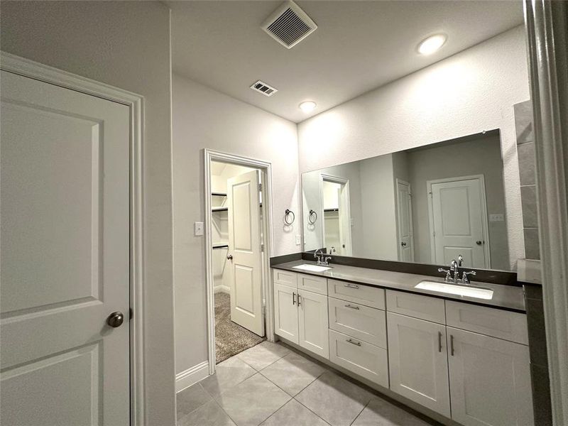 Bathroom with vanity and tile patterned flooring