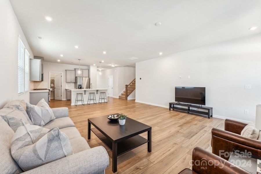 Living room, dining area and kitchen