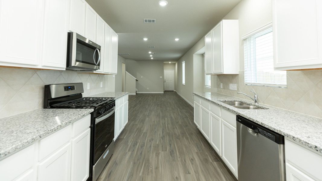 Kitchen to Dining Area and Family Room