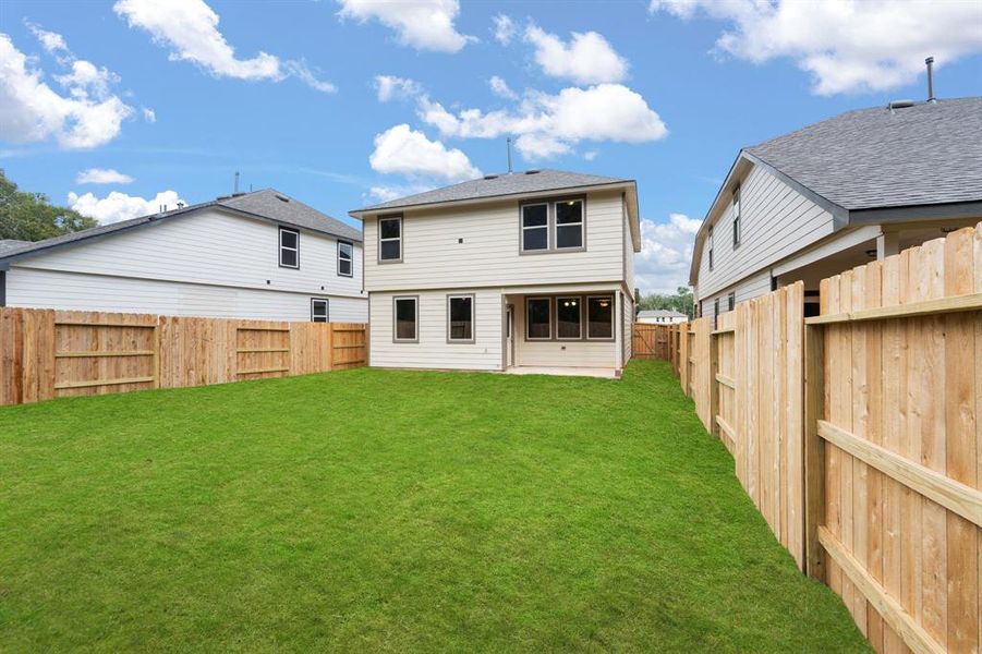 This backyard is perfect for family gatherings, social events, or simply unwinding in the fresh air.