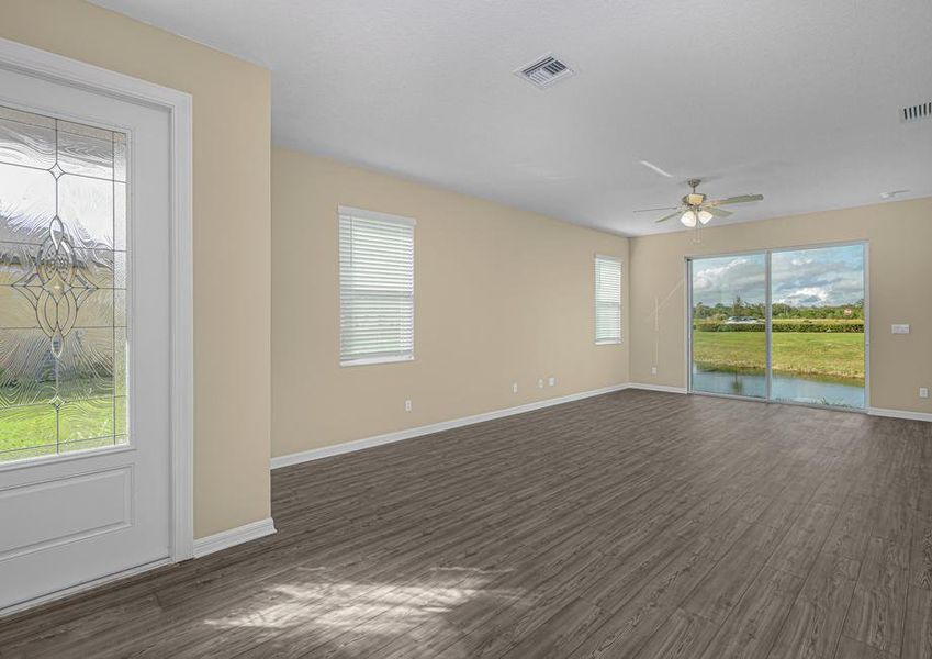 The family room has a sliding glass door that leads to the backyard