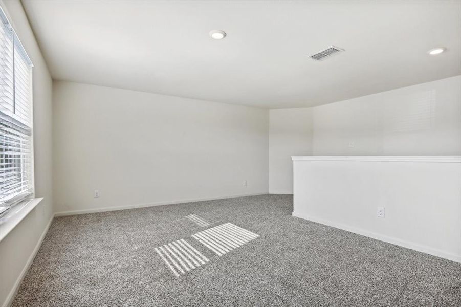 Game Room with carpet flooring and a wealth of natural light