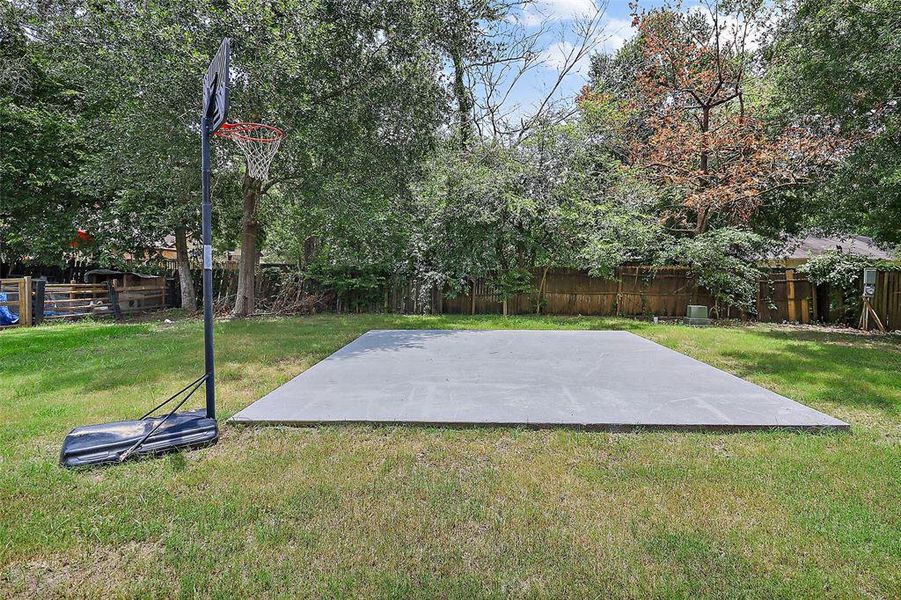 The concrete pad serves as a blank canvas, offering a stable foundation for a variety of activities and outdoor amenities. Its smooth, level surface provides ample space for hosting gatherings, setting up outdoor furniture, or creating a designated area for relaxation and entertainment.