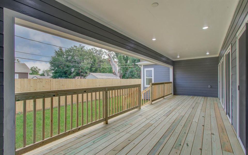 Relax on the covered back porch with recessed lights