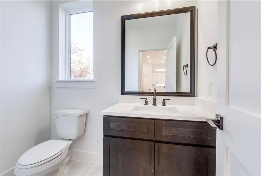 Bathroom with toilet and vanity