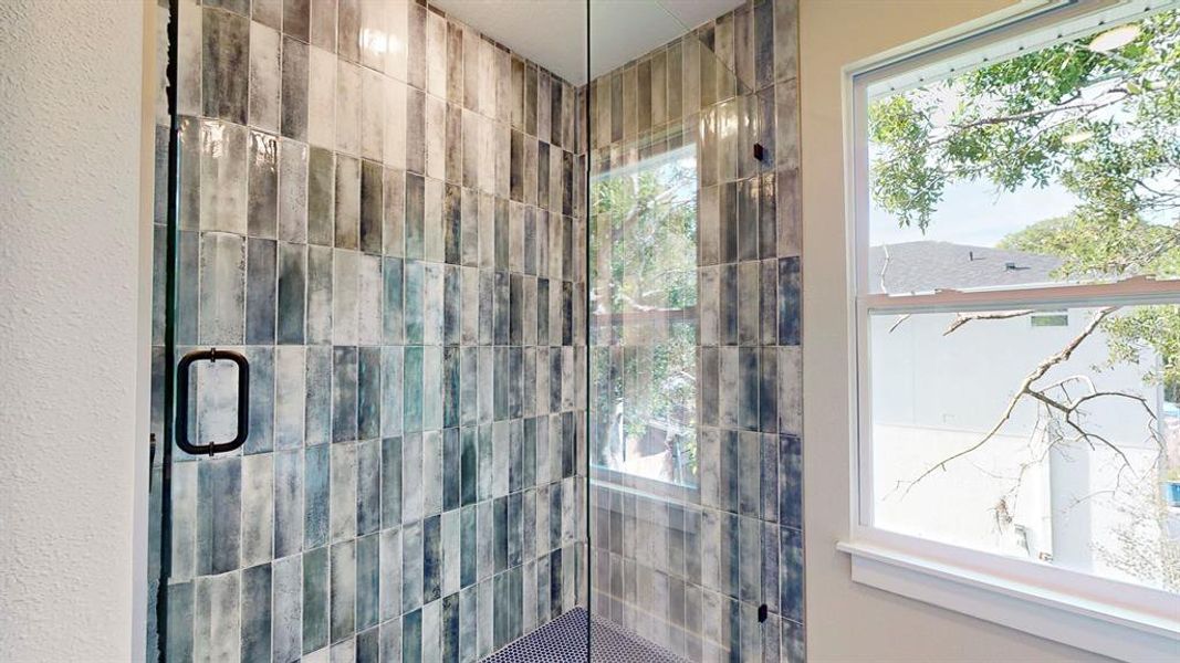 Tile is white in this home. This photo is of model while waiting on updated photography.