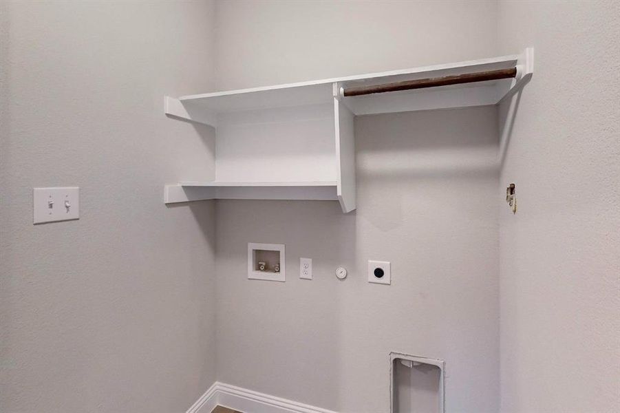 Laundry room featuring hookup for a gas dryer, hookup for a washing machine, and electric dryer hookup