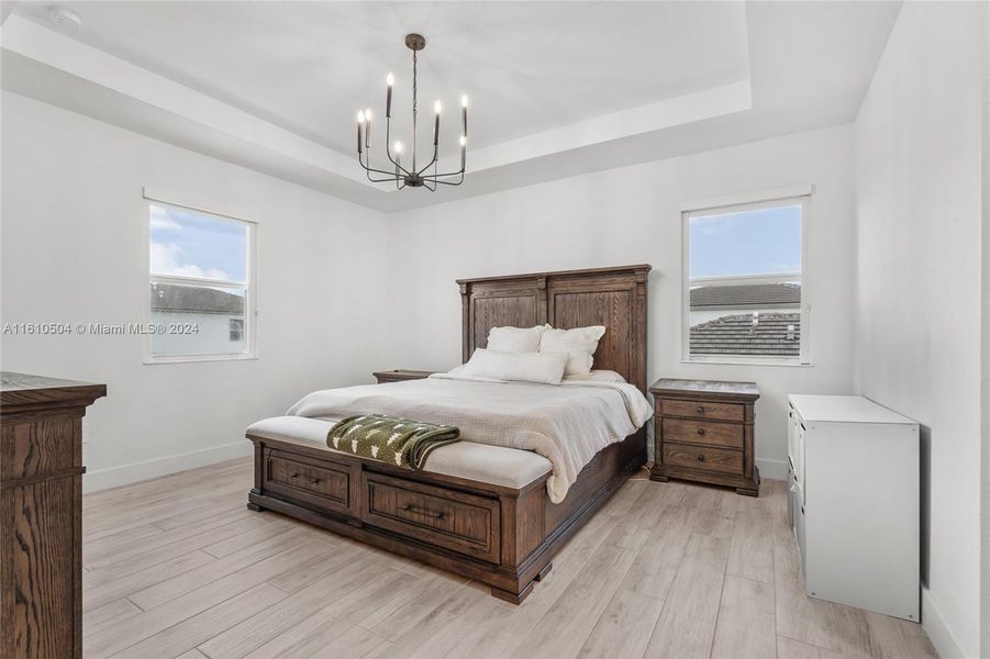 Primary Bedroom with Two Walk-In Closets and Bathroom Suite