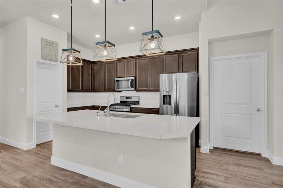 Open kitchen with large island, quartz countertops