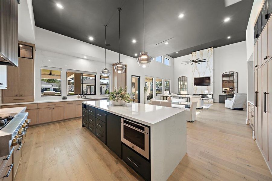 This angle from the kitchen,beautifully showcases the cased opening that effortlessly connects it to the breakfast area into the family room, ensuring smooth and uninterrupted entertaining experiences.