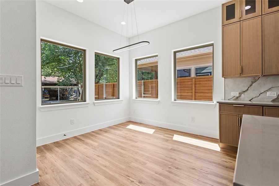 Unfurnished dining area with light hardwood / wood-style floors