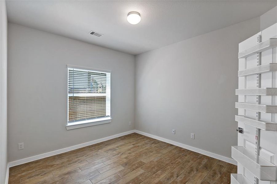 Guest room 3 with wood look tile flooring