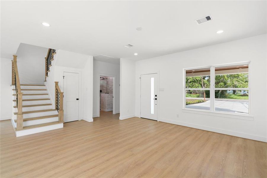 As you enter the front door, your are greeted by open floor plan and abundance of light poring through the man ywindows surrounding the living spaces.