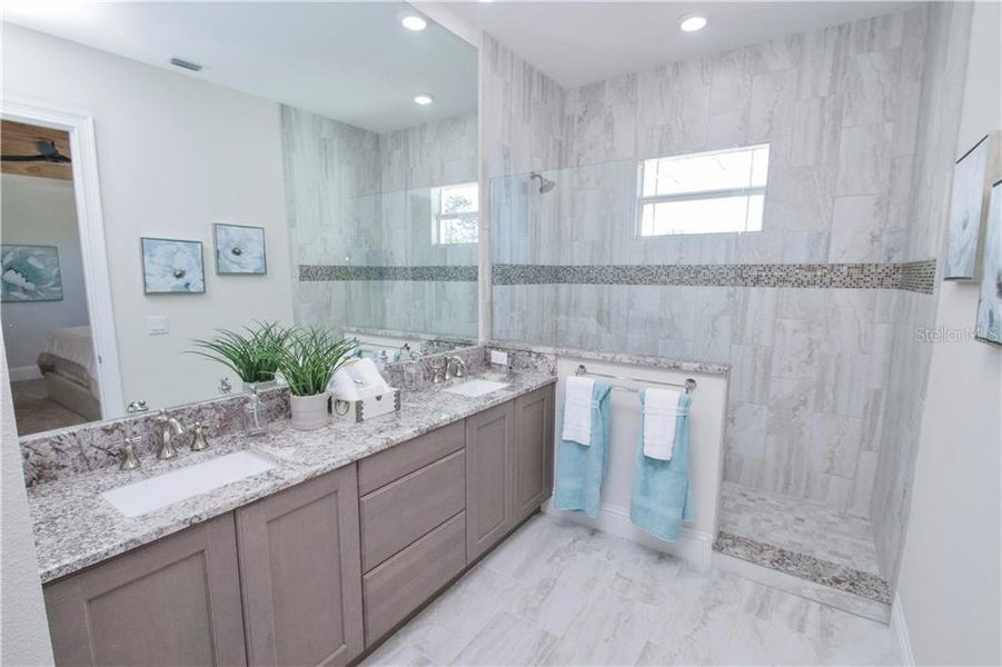 Owner's Ensuite Pictures are of builder’s model, actual townhome may differ in elevation and options.