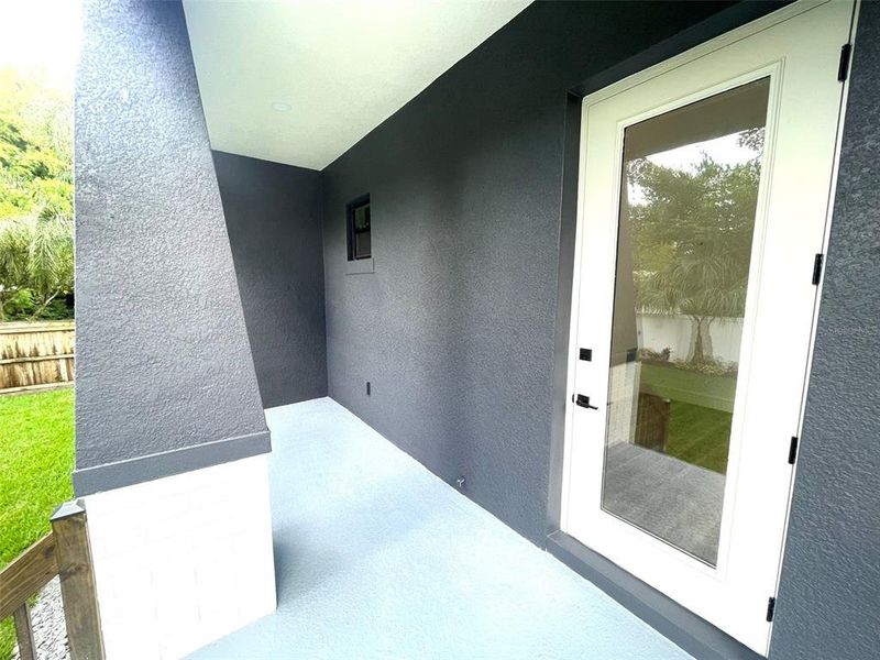 Beautiful rear porch overlooking backyard