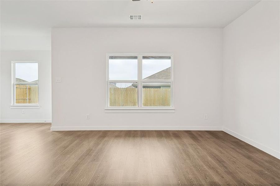 Spare room with wood-type flooring