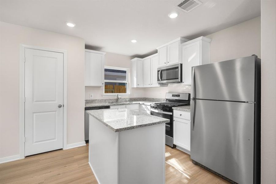 Stainless Steel appliances all included along with a breakfast bar.