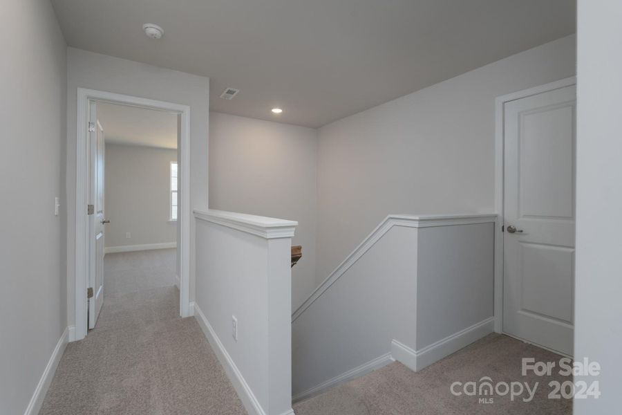 Upstairs Landing to Bedroom and Attic. Photo representation. Colors and options will differ.