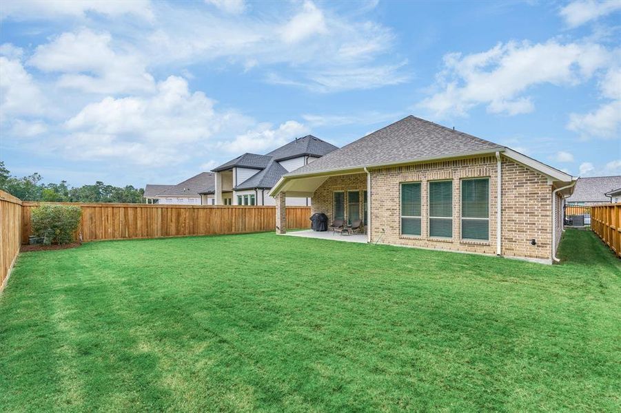 Private, tree-lined backyard has been well-maintained.