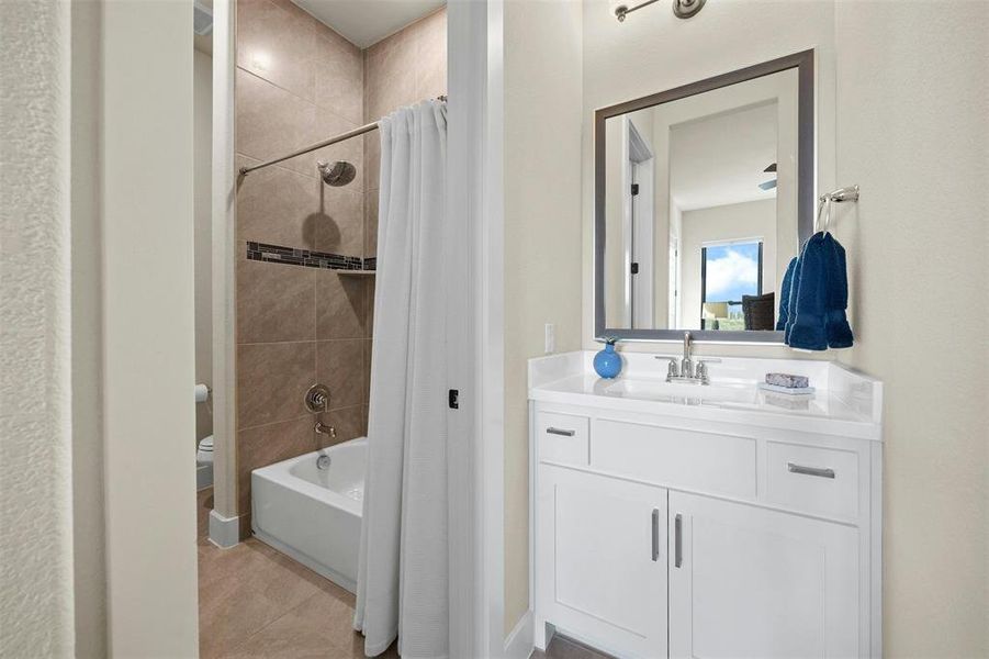 Shared Jack and Jill bath between two guest bedrooms.