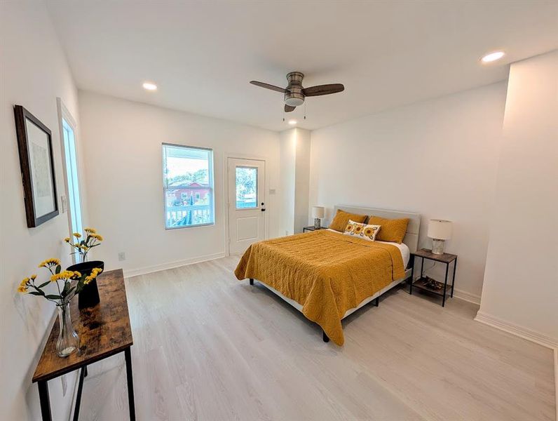 Primary bedroom with its own balcony