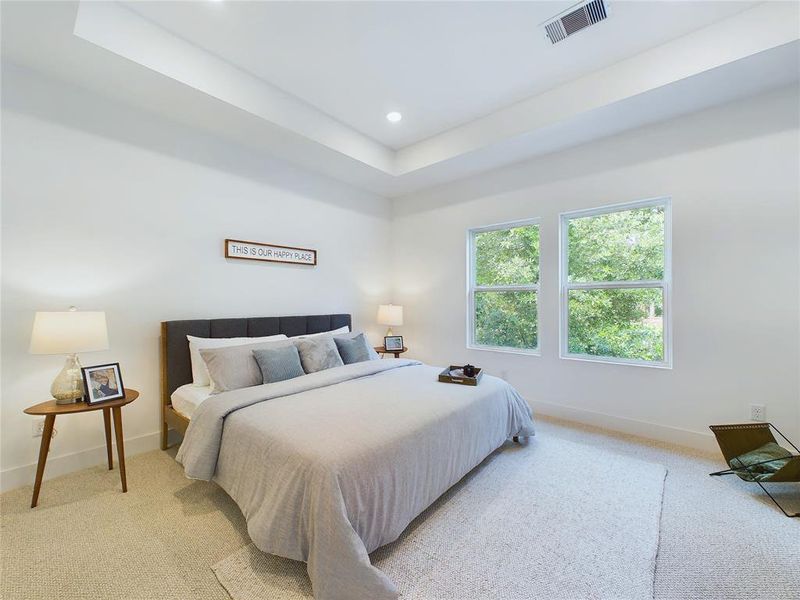 Elegant Primary Bedroom located on the 2nd floor. The high ceilings, with recessed lighting, are prewired and blocked for ceiling fans (not included). Model home photos, finishes and floor plan MAY VARY! Ceiling fans are NOT INCLUDED!