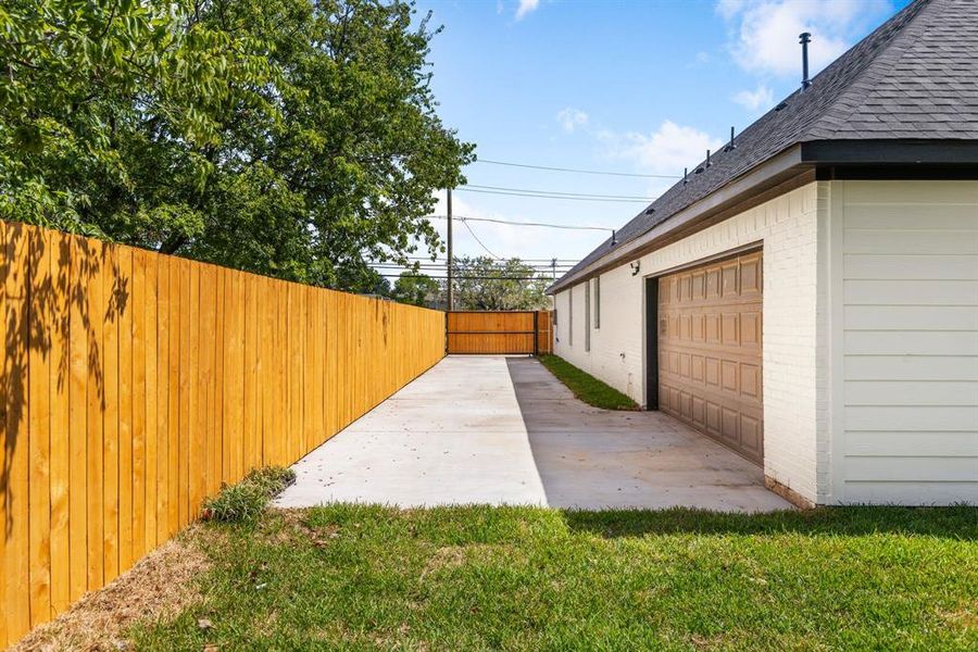 View of yard with a patio and a garage