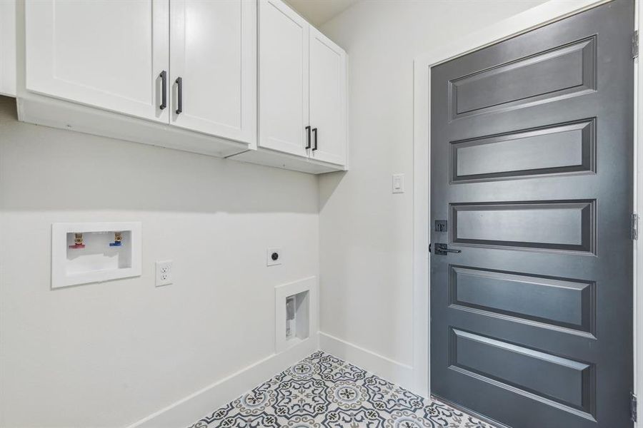 Laundry room with electric dryer hookup, cabinets, and washer hookup