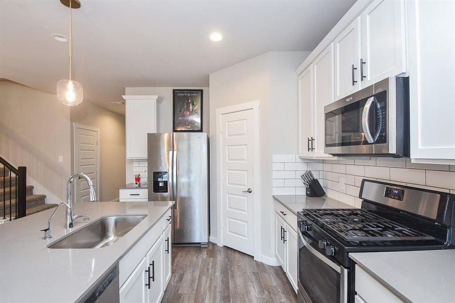 Detailed view of the kitchen counter and appliances.