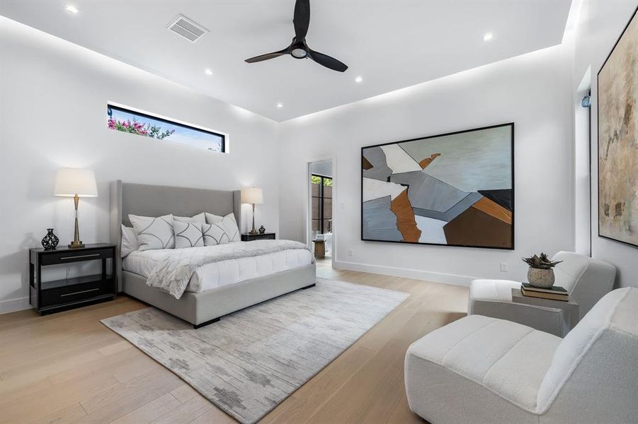 Bedroom featuring ceiling fan and light hardwood / wood-style floors