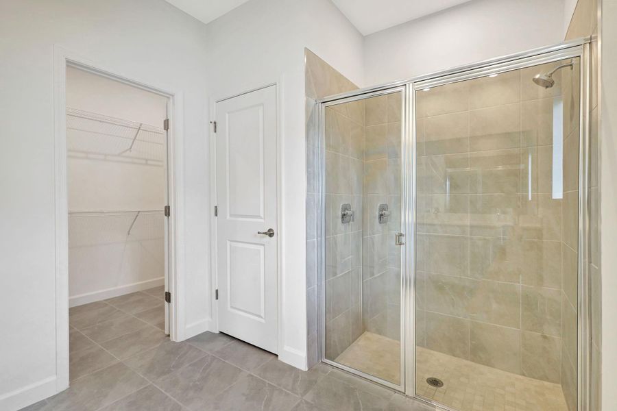 Huge shower, walk in closet and linen closet