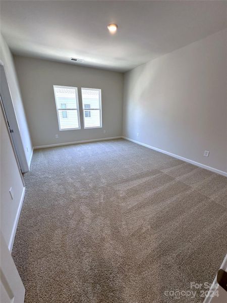 THIRD FLOOR FEATURES A LARGE PRIMARY BEDROOM