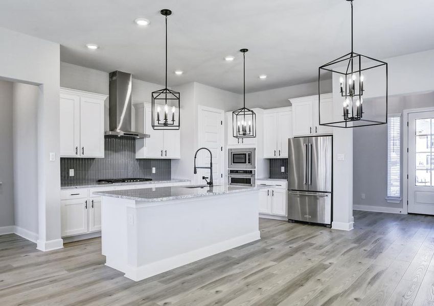 Fully-equipped kitchen with top-tier appliances and an oversized island.