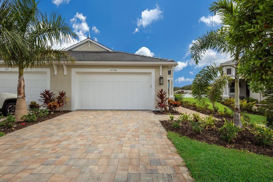 Move in Ready Boca Grande villa by Medallion Home located in the gated community of Watercolor Place. No CDDs.