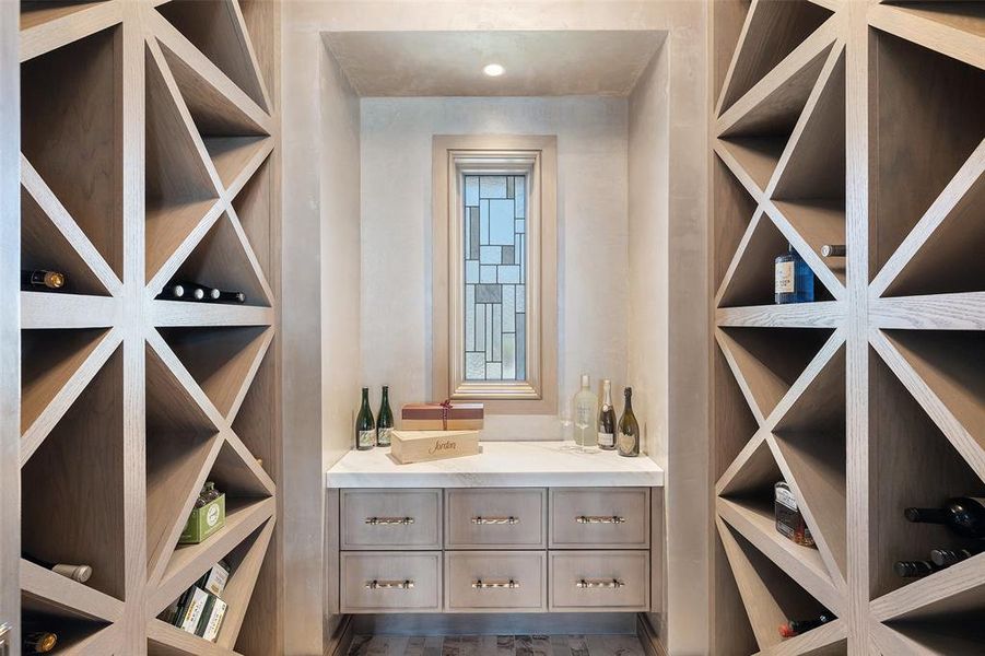 Enter the connoisseur's haven of the wine room, meticulously designed to showcase your prized collection in a temperature-controlled environment.